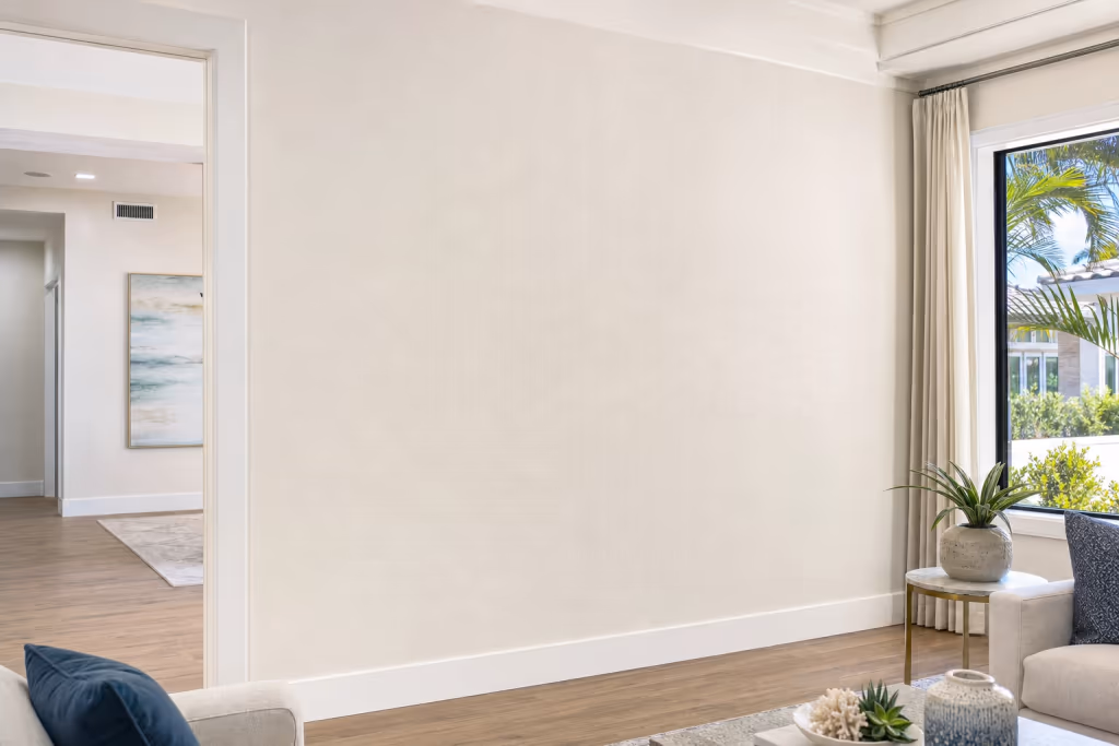 Close view of a flawless finished Florida living room wall after drywall repair, with perfectly matched texture and paint